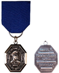 The medal has a silver finish and bears the portrait of Compatriot General of the Army Douglas MacArthur on the obverse within the inscription, “The National Society of the Sons of the American Revolution.” The reverse is inscribed “Awarded to _____ for Patriotic Service by the Society SAR, 20__. The medal is suspended from a chest ribbon of royal blue color. The Patriot Medal is available in full and miniature sizes.


